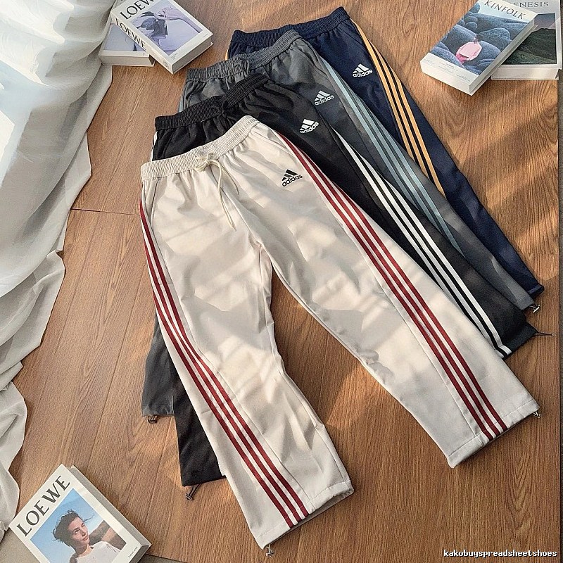 Adidas Three-Stripe Side Panels And An Easy Athletic Cut Striped Track Pants for daily